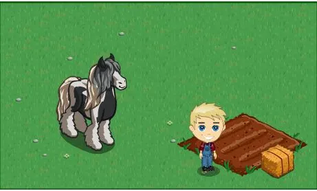 A child standing next to a pony on a grassy area with a stack of hay.