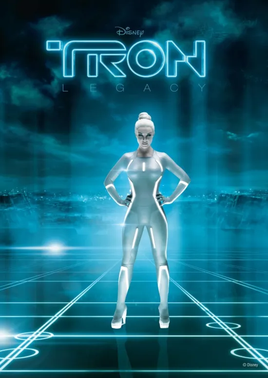 A female character in a futuristic silver suit against a glowing blue digital background, reminiscent of the movie "Tron."