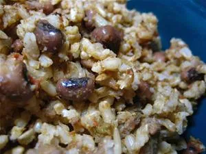 Cooked mixed grains with beans in a blue bowl.