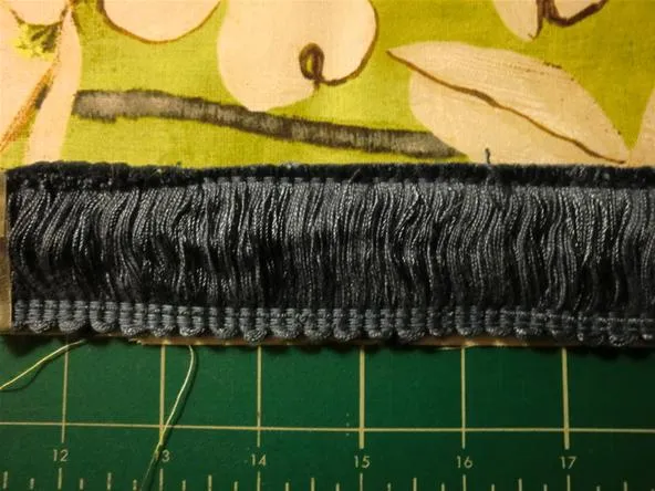 Close-up of textured fabric with decorative stitching.