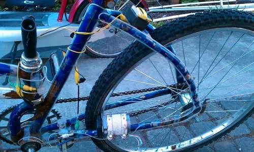 Bicycle with a blue frame and innovative modifications.