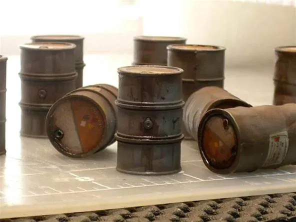 Barrels arranged on a surface.