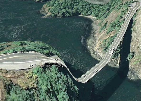 Curved bridge over a river surrounded by greenery.