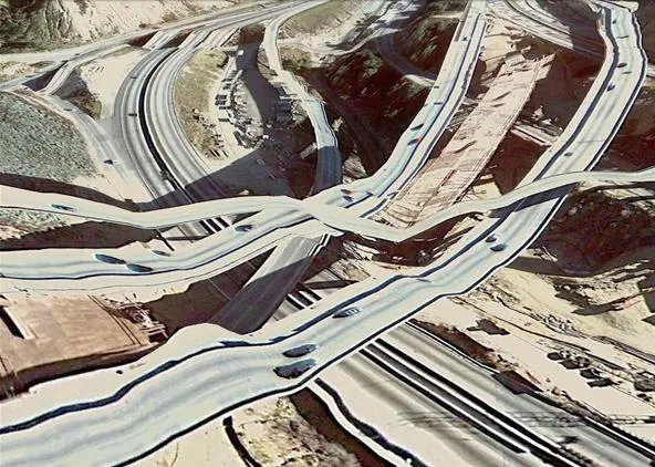 Aerial view of a complex highway interchange.
