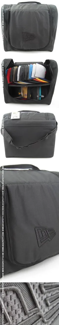 Black tote bag with organized compartments and colorful items inside.
