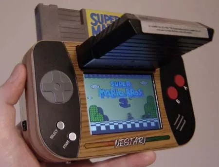 Handheld gaming device displaying gameplay from Super Mario.