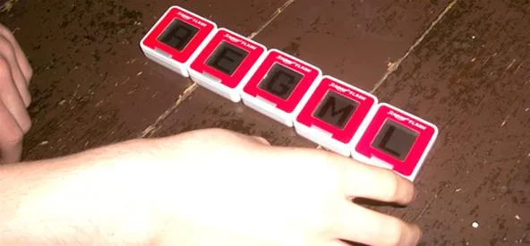 Playing a word game with letter tiles.