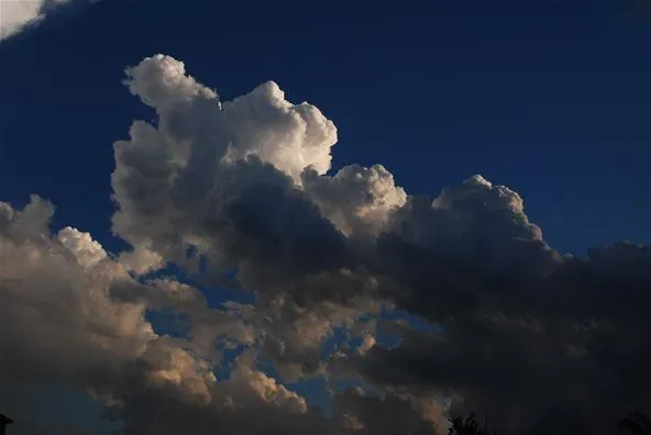Dramatic clouds against a blue sky.