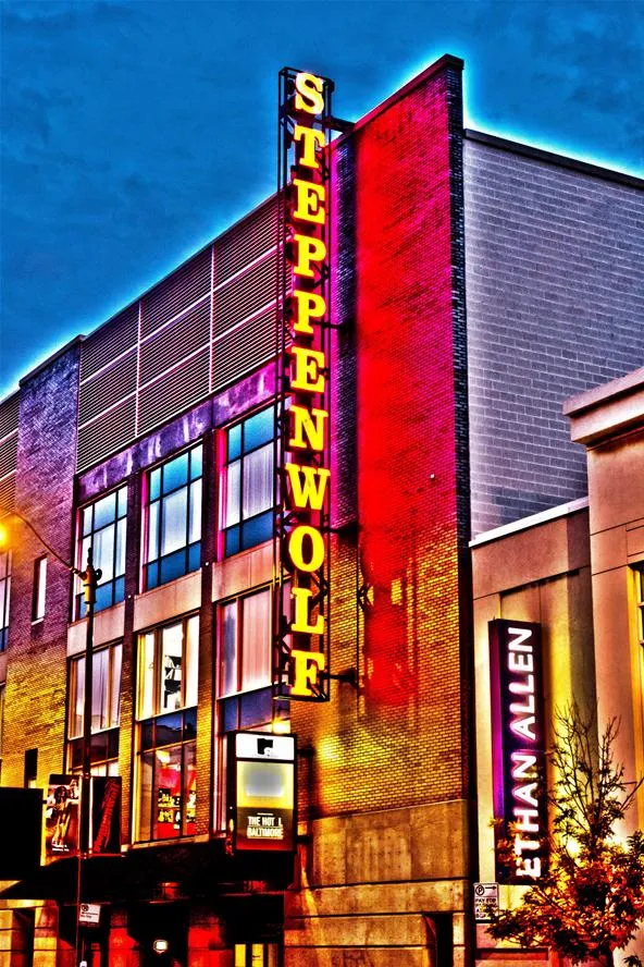 Steppenwolf Theatre exterior at night with neon signage.