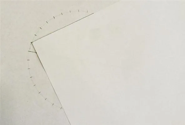 Diagonal line and arc drawn on a blank sheet of paper.