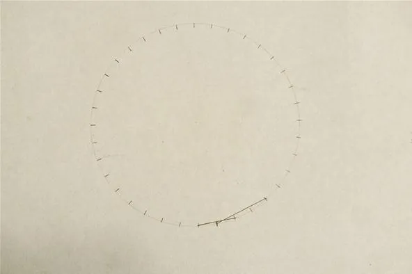 Diagram of a circle with numerical markings and a curved line.