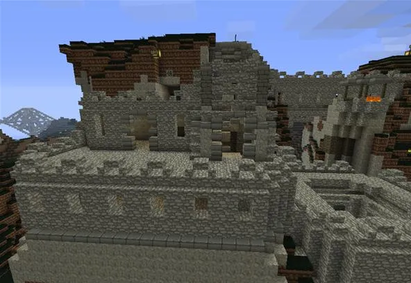 Minecraft castle ruins in a scenic landscape.