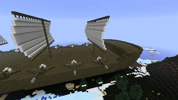 Minecraft ship with large sails in a snowy landscape.