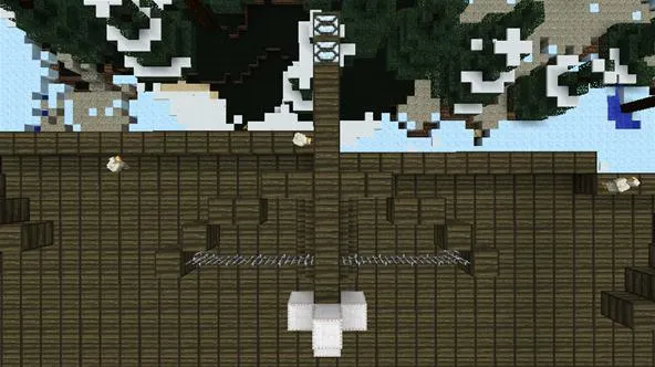 Aerial view of a wooden structure with a central tower and surrounding pathways.