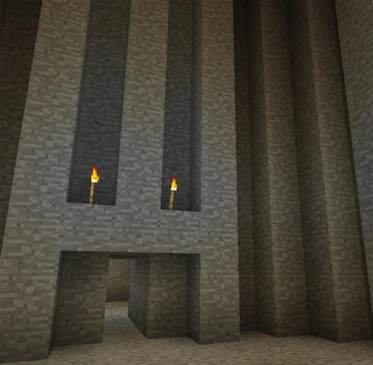 Minecraft stone structure with torches.