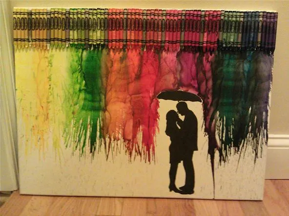 Silhouette of a couple under an umbrella with a colorful background made of melted crayons.