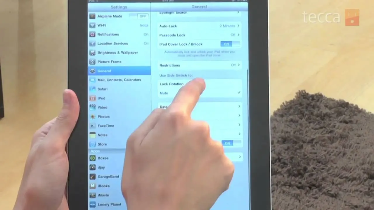 Person using a tablet to navigate settings.