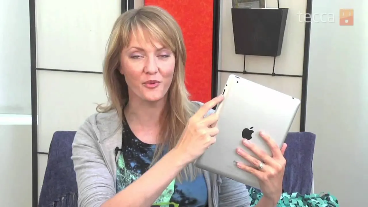 Woman demonstrating an iPad in a casual setting.