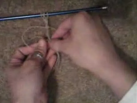 Person tying a knot with a piece of string.