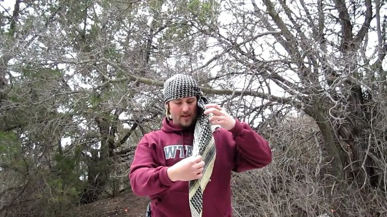 Person holding a large fish outdoors.