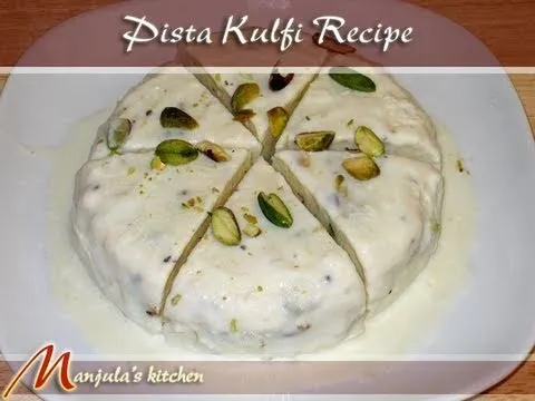 Pista Kulfi dessert sliced and garnished with pistachios.