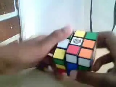 Person solving a Rubik's Cube.
