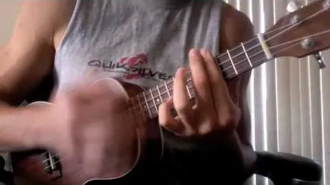 Person playing a ukulele.