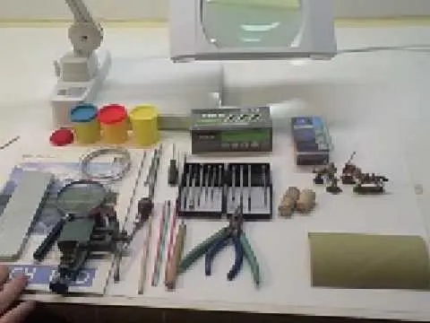 Tool and craft supplies arranged on a workbench.