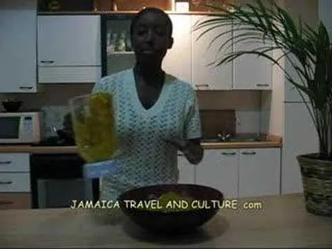 Woman preparing food in a kitchen setting.