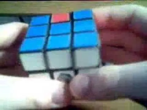 Rubik's Cube held in hands with a partially solved side.