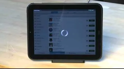 Tablet displaying a loading screen with a list of content.