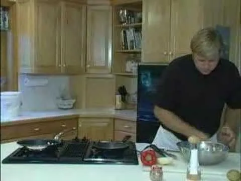 A person preparing food in a modern kitchen.