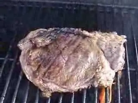 Grilled steak on a barbecue grill.