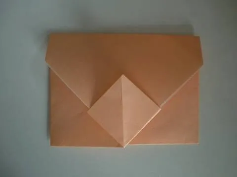 Origami envelope in a peach color.