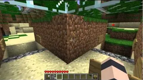 Minecraft gameplay showing a player interacting with a block in a sandbox environment.