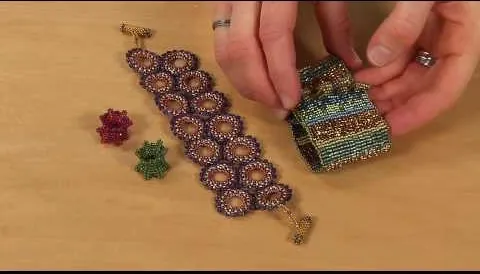 Beaded bracelet and decorative box with colorful gemstones.
