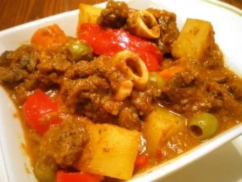 Beef stew with vegetables in a bowl.