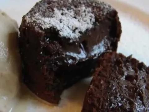 Chocolate lava cake with a gooey center, dusted with powdered sugar.