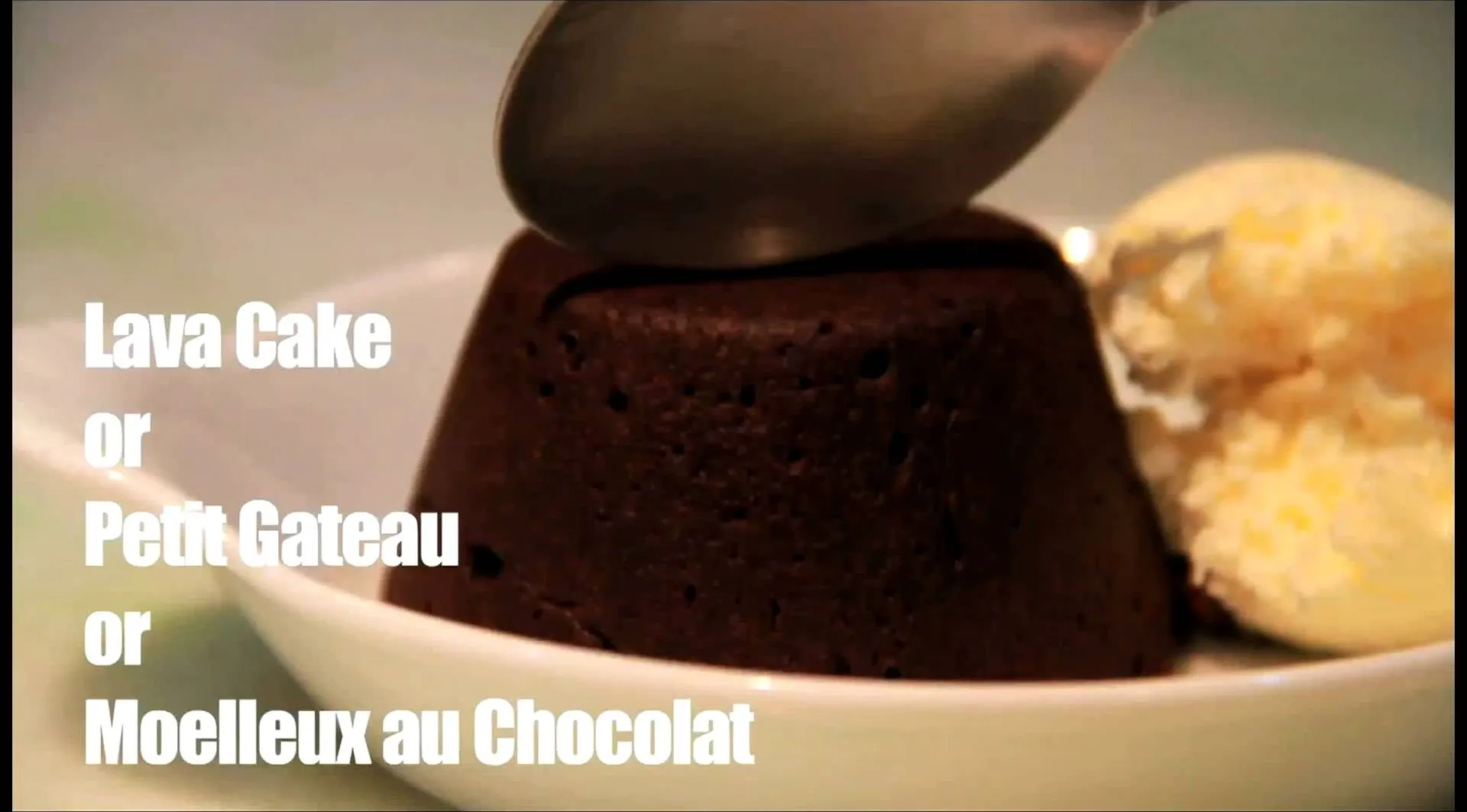 Chocolate lava cake with a scoop of vanilla ice cream.
