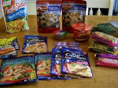 Assorted packaged meals and side dishes displayed on a table.