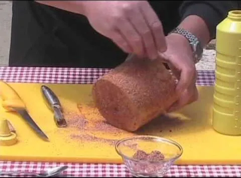 Slicing freshly baked bread on a cutting board.