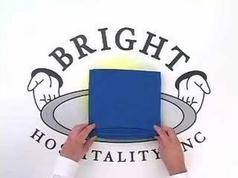 A person placing a blue cloth on a serving platter with the logo of Bright Hospitality Inc. in the background.