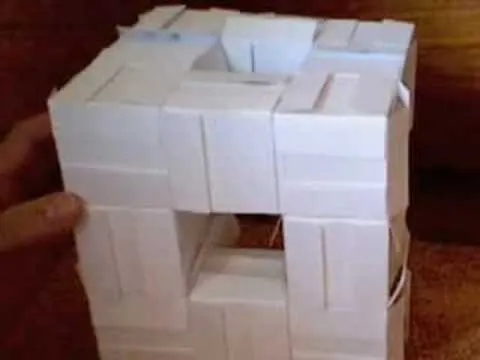 3D model made of white building blocks with a hollow center.