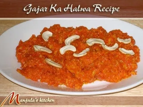 Gajar Ka Halwa served with cashews on a white plate.