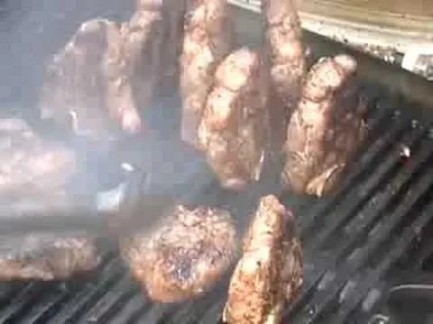 Grilled meats on a barbecue grill.