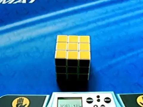 Rubik's Cube on a blue surface with a timer display.