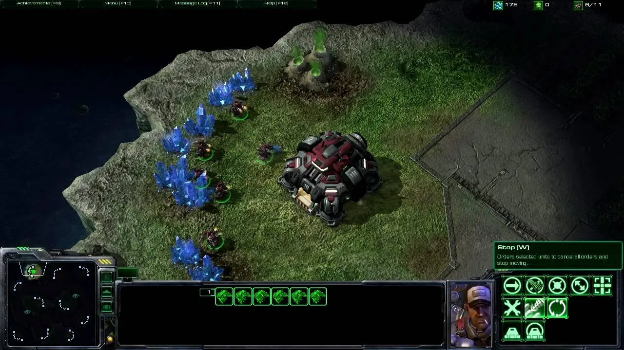 Gameplay screenshot of a strategy video game featuring a base and resource collection units.