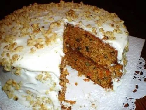 Carrot cake with cream cheese frosting and nuts.