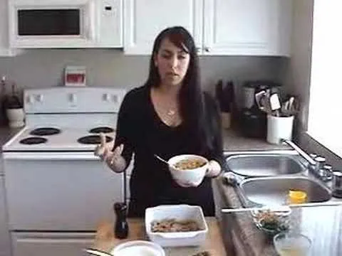 Woman preparing food in a kitchen.