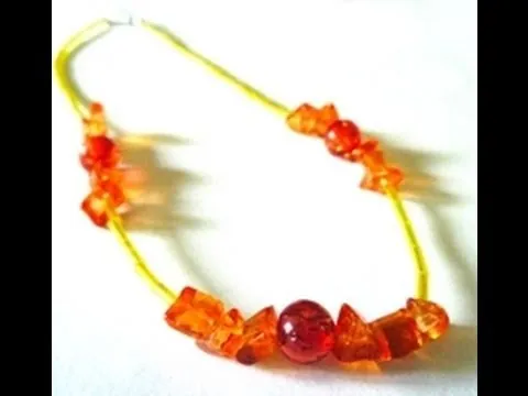 Colorful beaded necklace with orange and yellow accents.